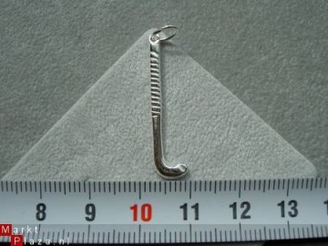 Zilveren hockey stick hanger
